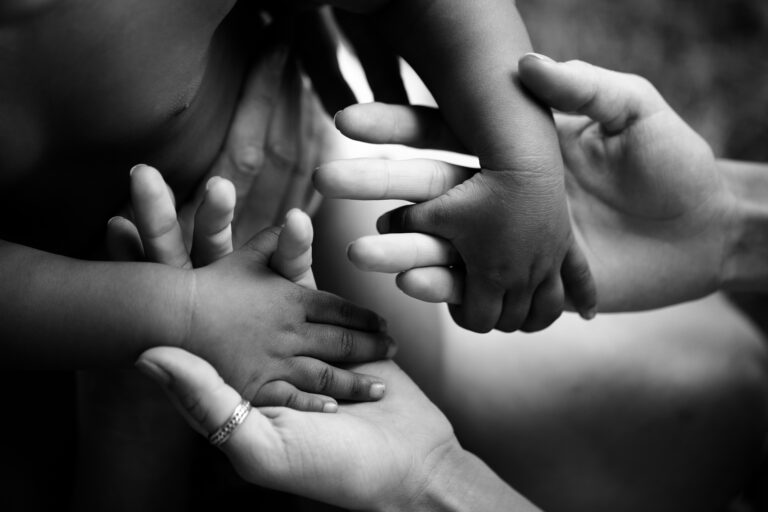 Black children’s hands hold white hands of adult. Friendship, Adoption and care. Joy of parenting. Trust and family. Happy childhood. African child. Hope for future, father mother and son or daughter